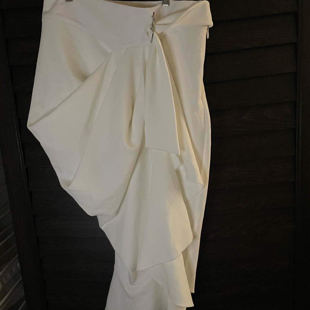 White Asymmetrical skirt with faux leather waistband and D-Ring belt.